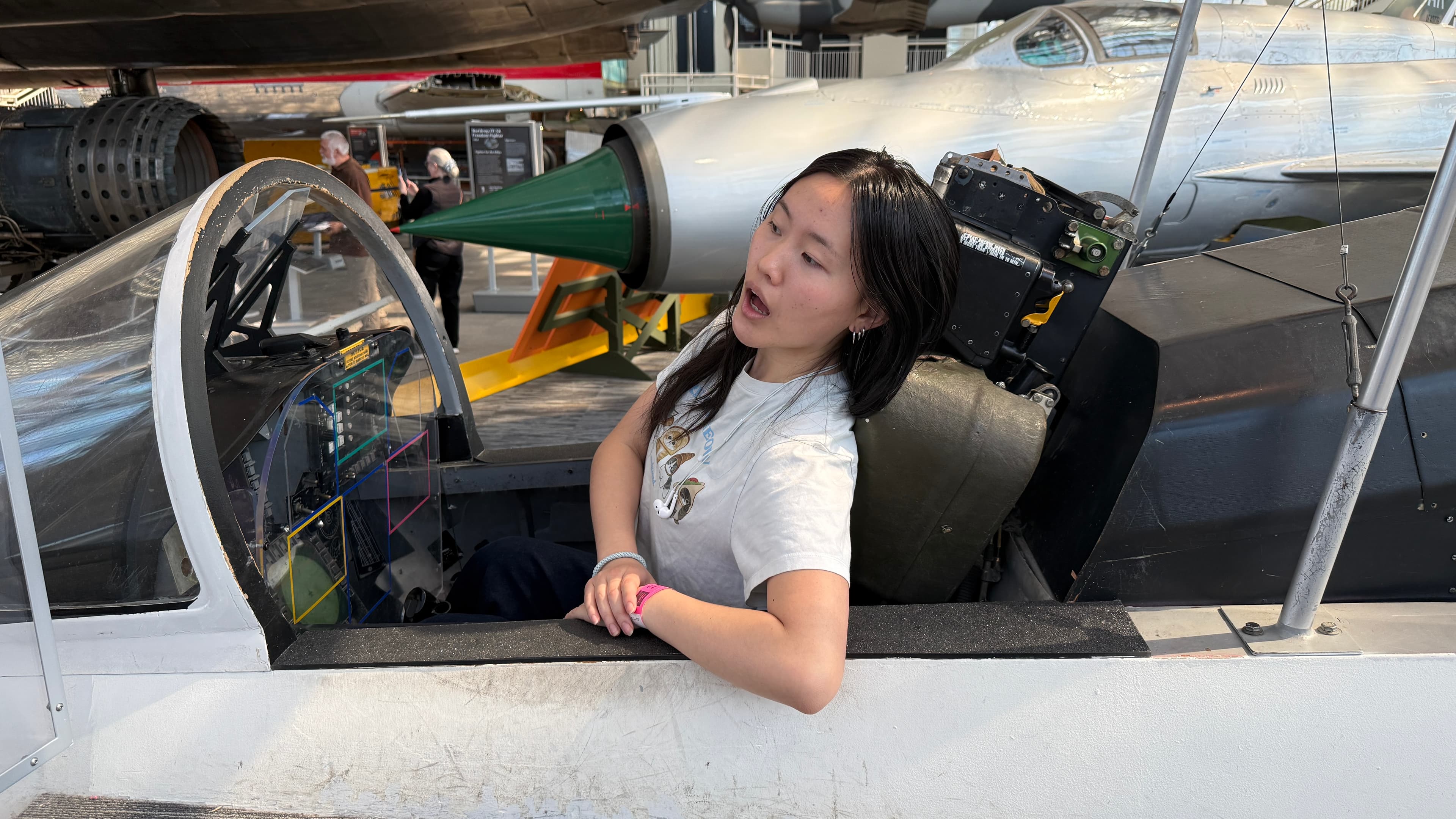 Ariana sitting in plane sideways